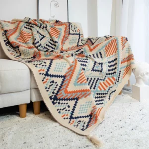 Grobstrickdecke mit Quasten